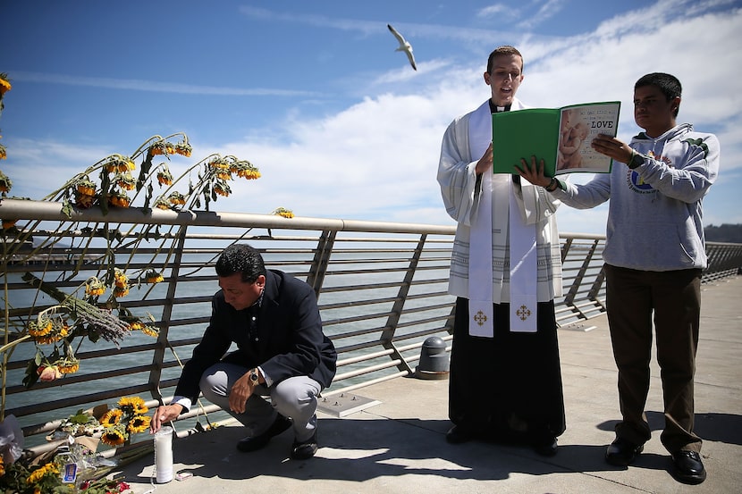 SAN FRANCISCO, CA - JULY 06:  Father Cameron Faller (C), associate pastor at the Church of...