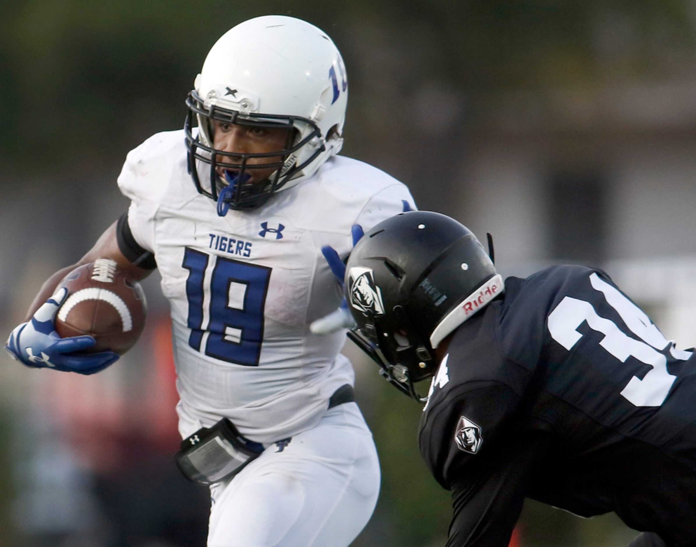 Trinity Christian-Cedar Hill running back Emari Matthews (18) looks for running room out of...