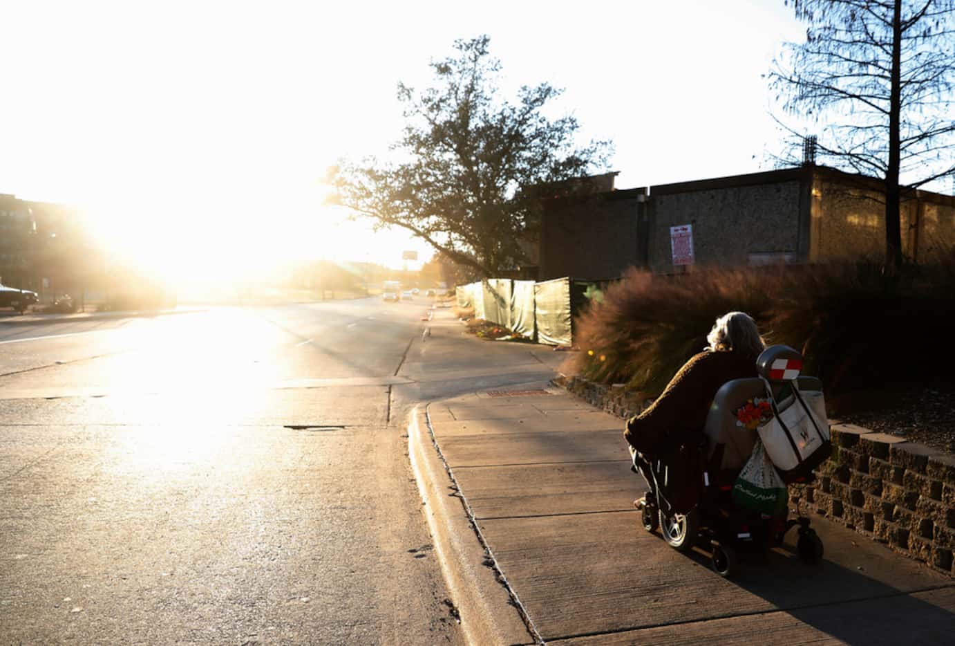 Melody Townsel maneuvers her wheelchair as she heads to her home in The Cedars neighborhood...