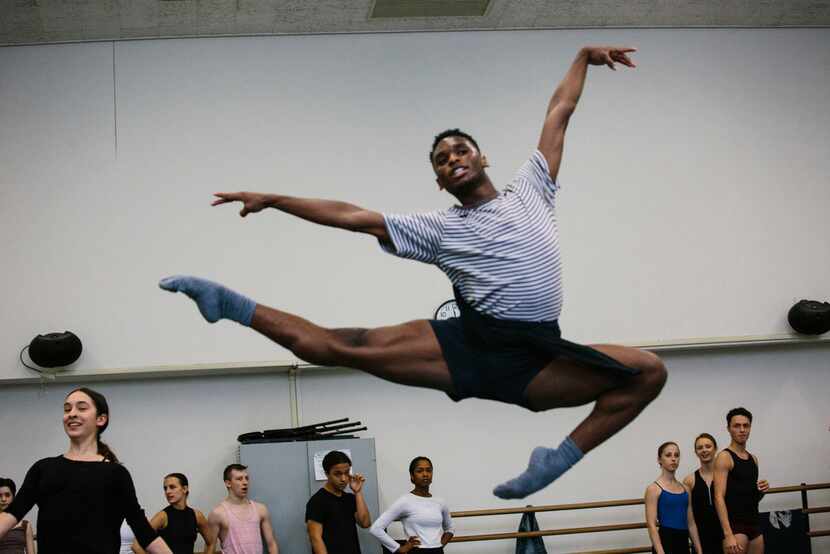 Ricardo Hartley, 19, a Booker T. Washington alumnus, warms up during first year ballet class...