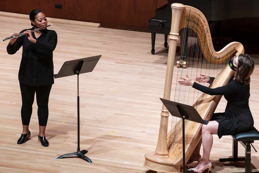 Flutist Ebonee Thomas and harpist Emily Levin perform 'Serenade No. 10,' for flute and harp,...