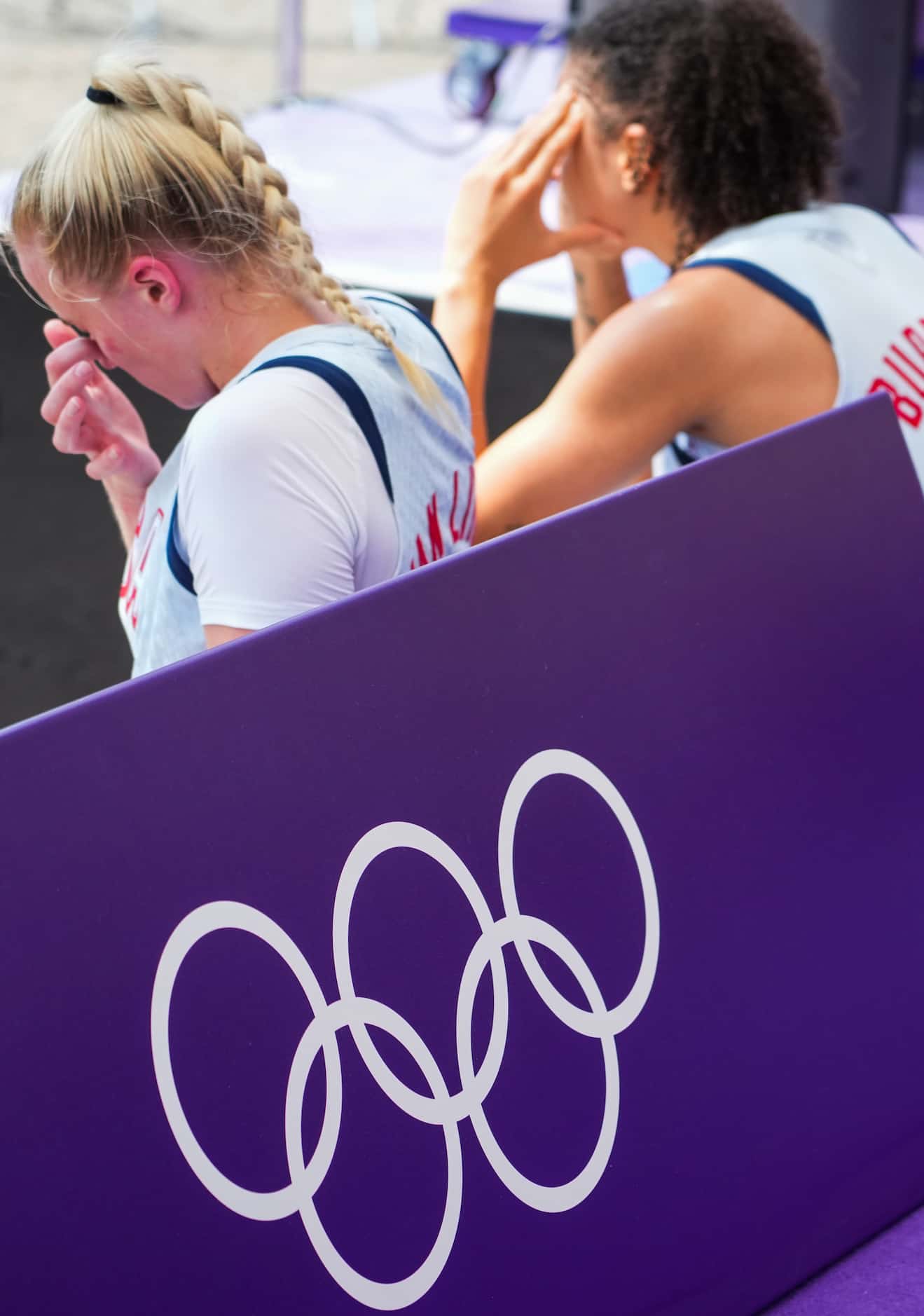Hailey van Lith (left) and Cierra Burdick of the United States sit near the court after a...