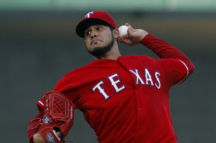 Texas Rangers starting pitcher Martin Perez (33) works against the Boston Red Sox at Globe...