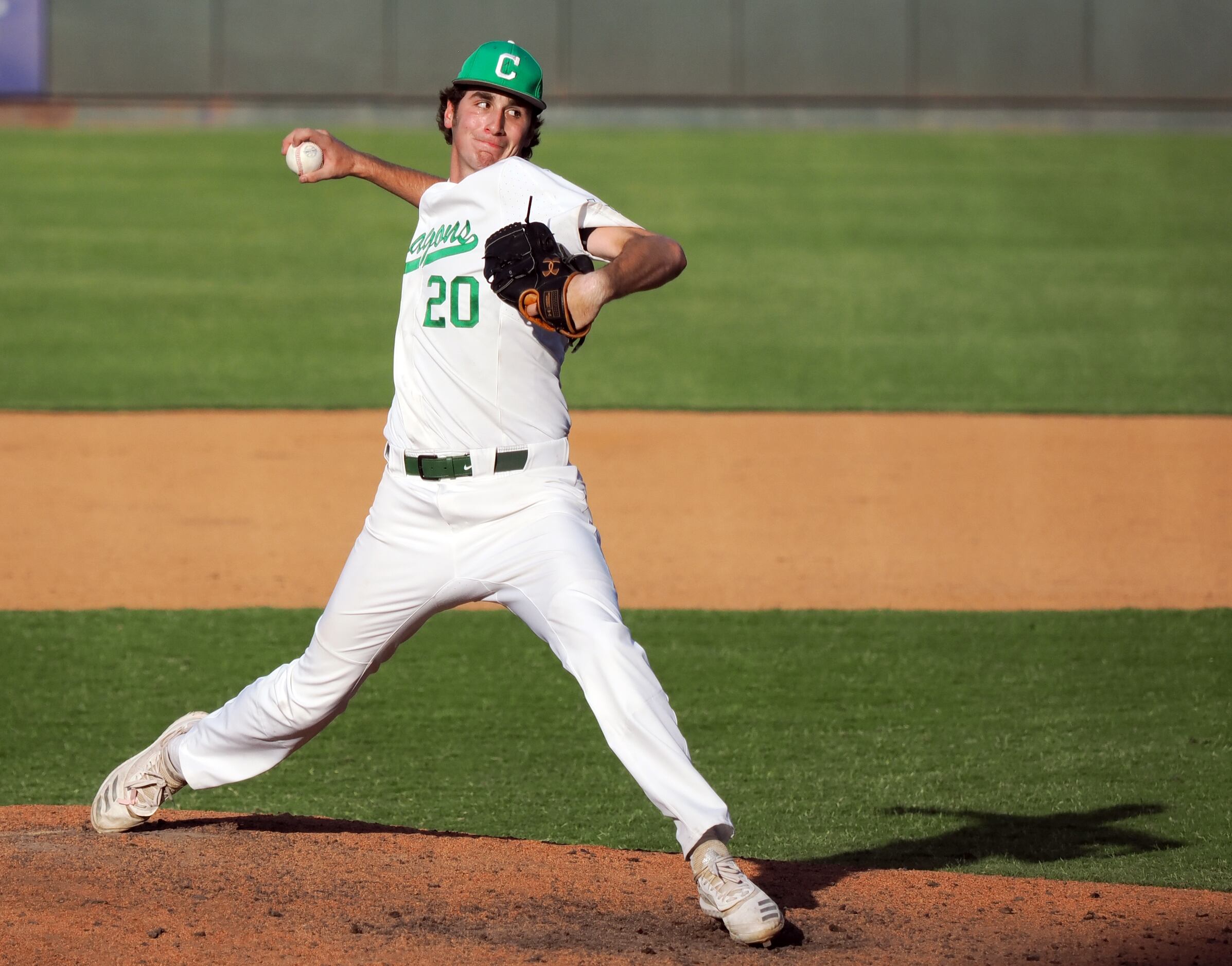 Southlake Carroll relief pitcher Tyler White (20) pitches the final strike to defeat San...
