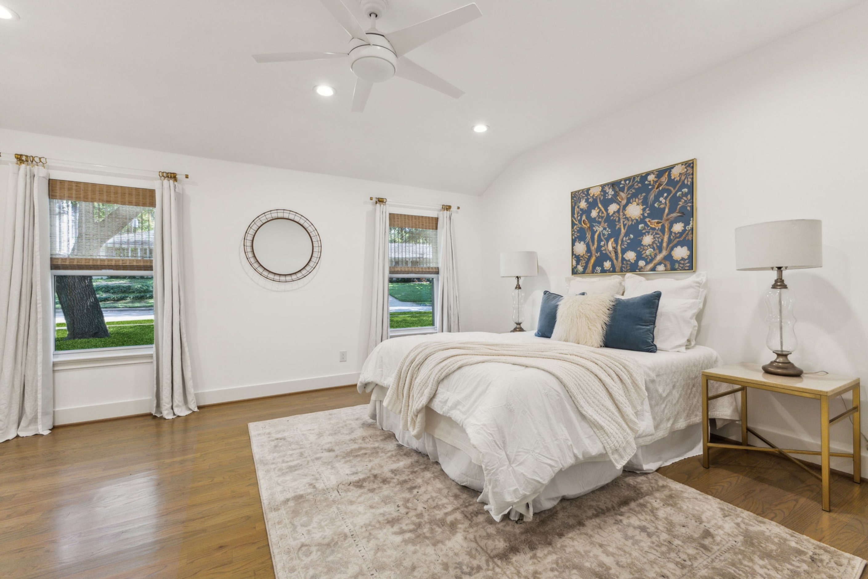 The primary bedroom has raised ceilings that give it a spacious feel.