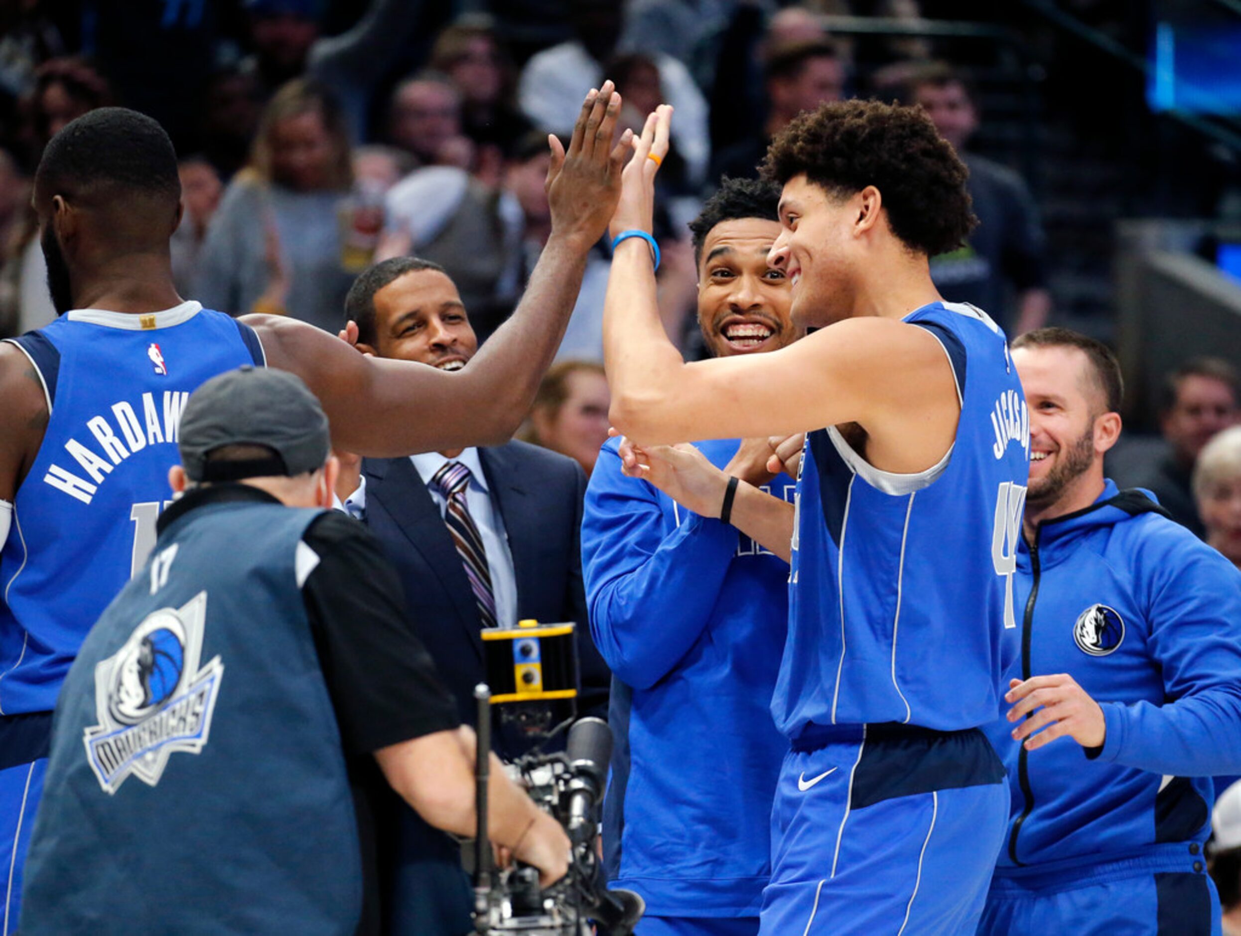 Dallas Mavericks forward Justin Jackson (44) is congratulated by teammates after hitting a...