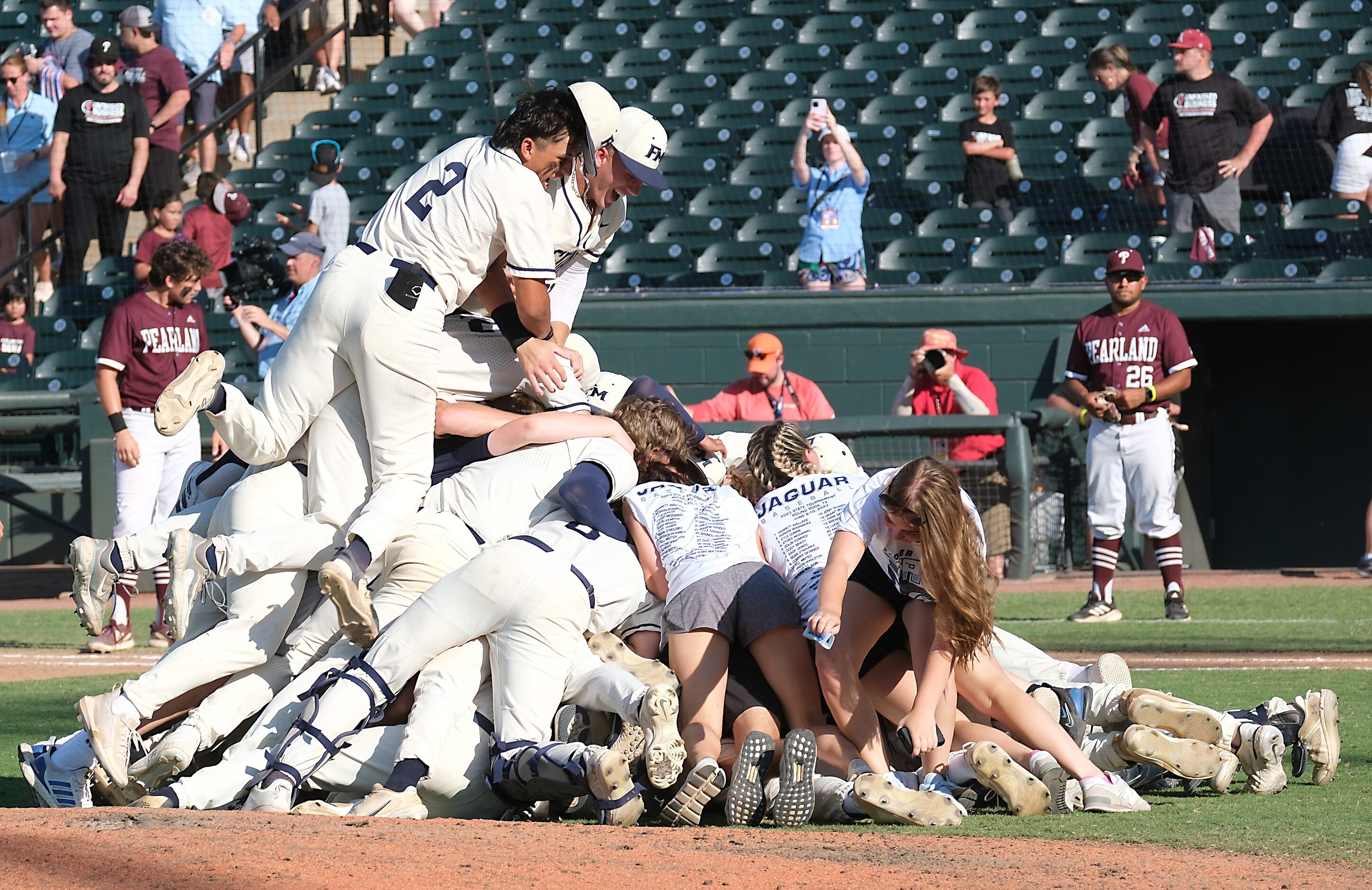 The Flower Mound team celebrates on the pitchers mound after defeating Pearland in the 2023...