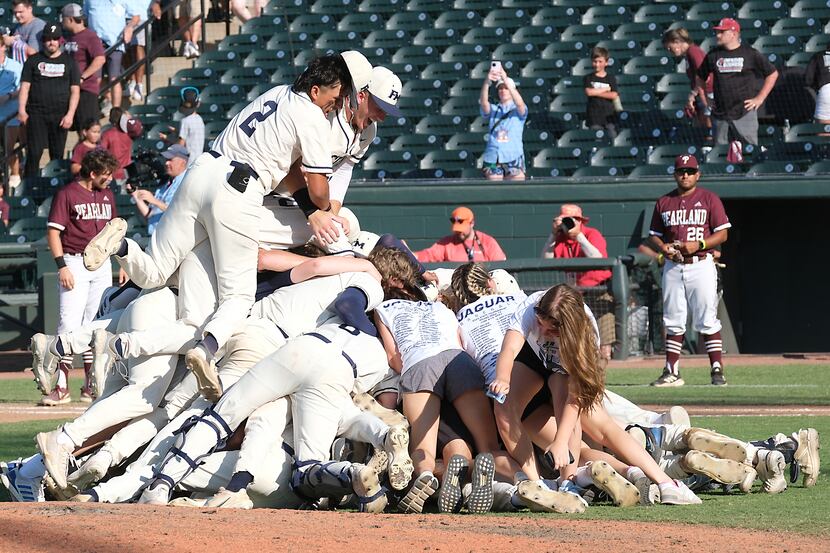 The Flower Mound team celebrates on the pitchers mound after defeating Pearland in the 2023...