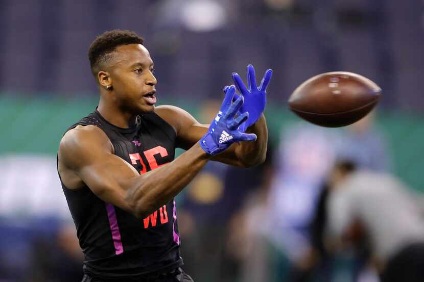 SMU wide receiver Courtland Sutton runs a drill during the NFL football scouting combine,...