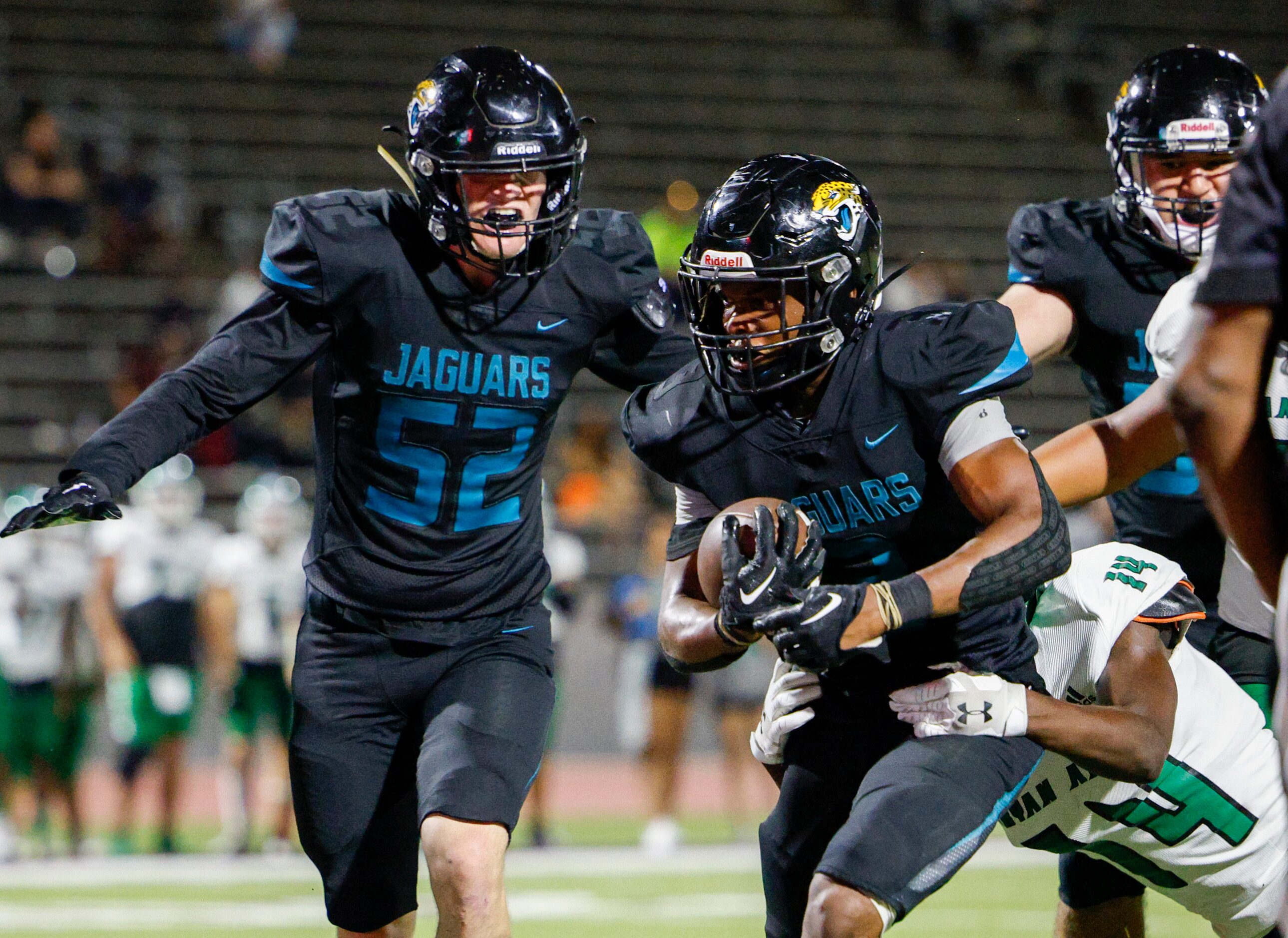 Molina running back Glen Jackson (3) drags Bryan Adams defensive back Camran Savage (14) as...