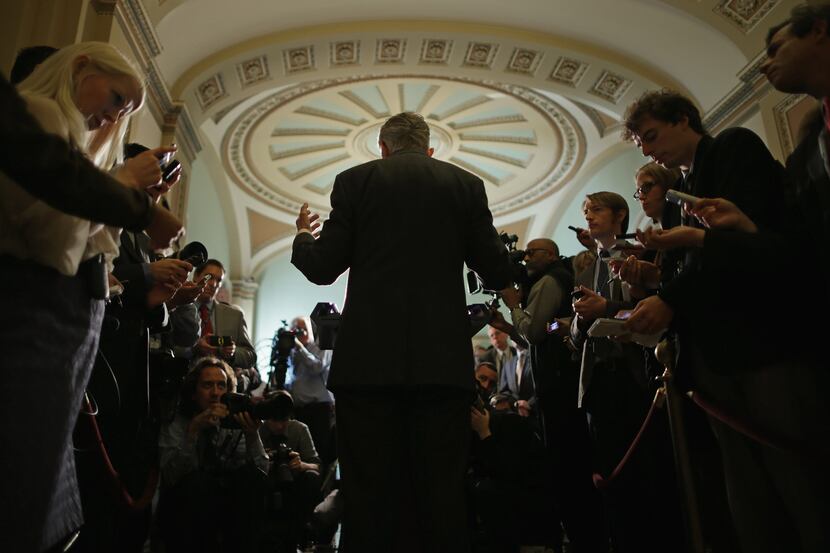 WASHINGTON, DC - NOVEMBER 05:  Senate Majority Leader Harry Reid (D-NV) (C) talks with...
