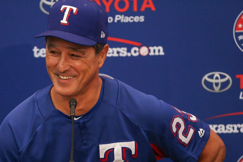Don Wakamatsu, who has been named interim manager of the Texas Rangers, addresses members of...