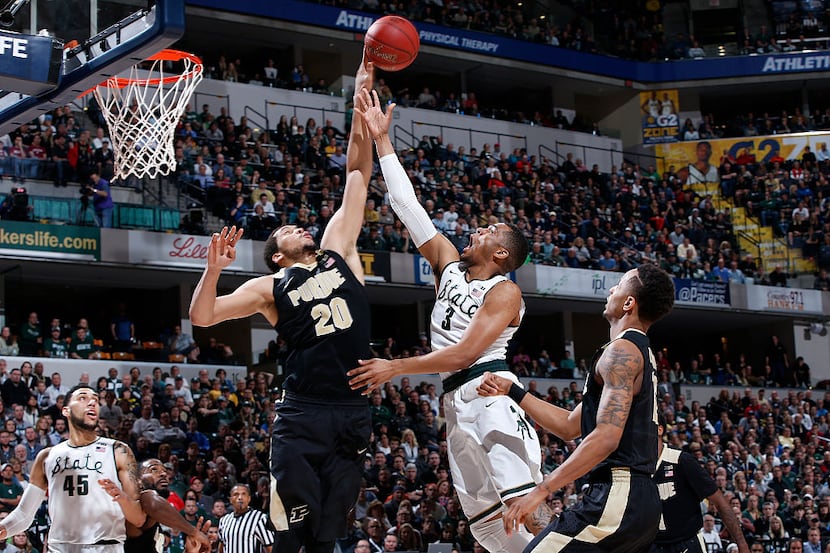 INDIANAPOLIS, IN - MARCH 13: Alvin Ellis III #3 of the Michigan State Spartans has his shot...