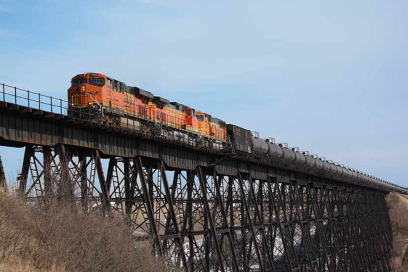 A BNSF train  of tanker cars crosses a trestle on the outskirts of Minot, N.D. Fort...