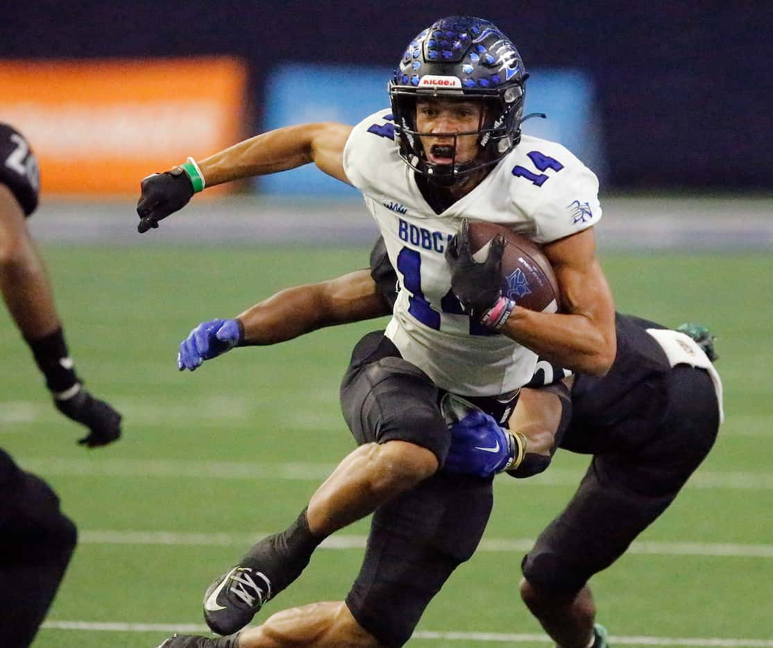 Byron Nelson High School wide receiver Landon Ransom-Golez (14) gets past Guyer High School...