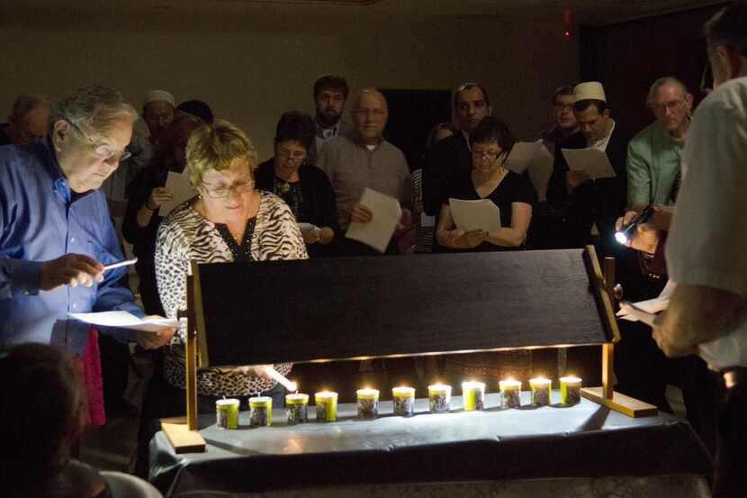 
Dr. Gary Ackerman and his wife, Ellen, on Saturday lighted memorial candles at Congregation...
