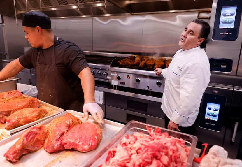 Cris Vázquez (right), executive chef of the Texas Rangers, visited one of the many kitchens...