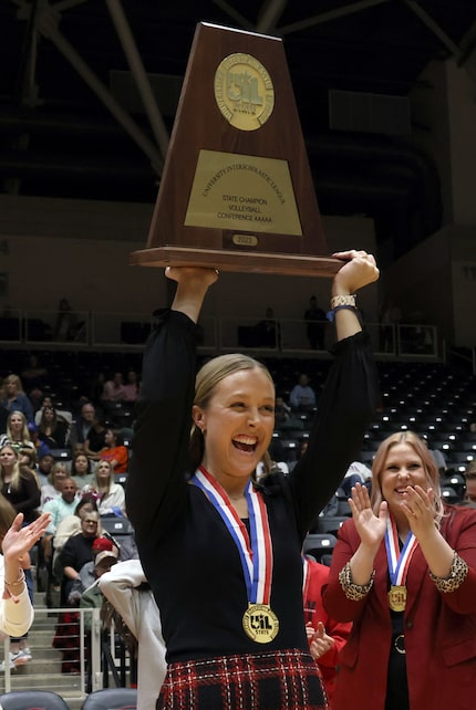 Lucas Lovejoy head coach Natalie Puckett beams as she hoists the Class 5A state championship...