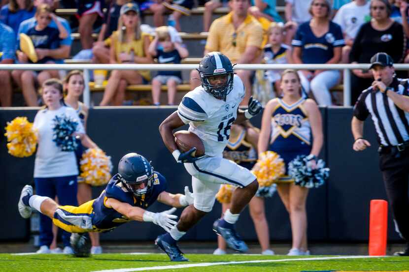 Frisco Lone Star wide receiver Marvin Mims (18) scores on the first play from scrimmage past...