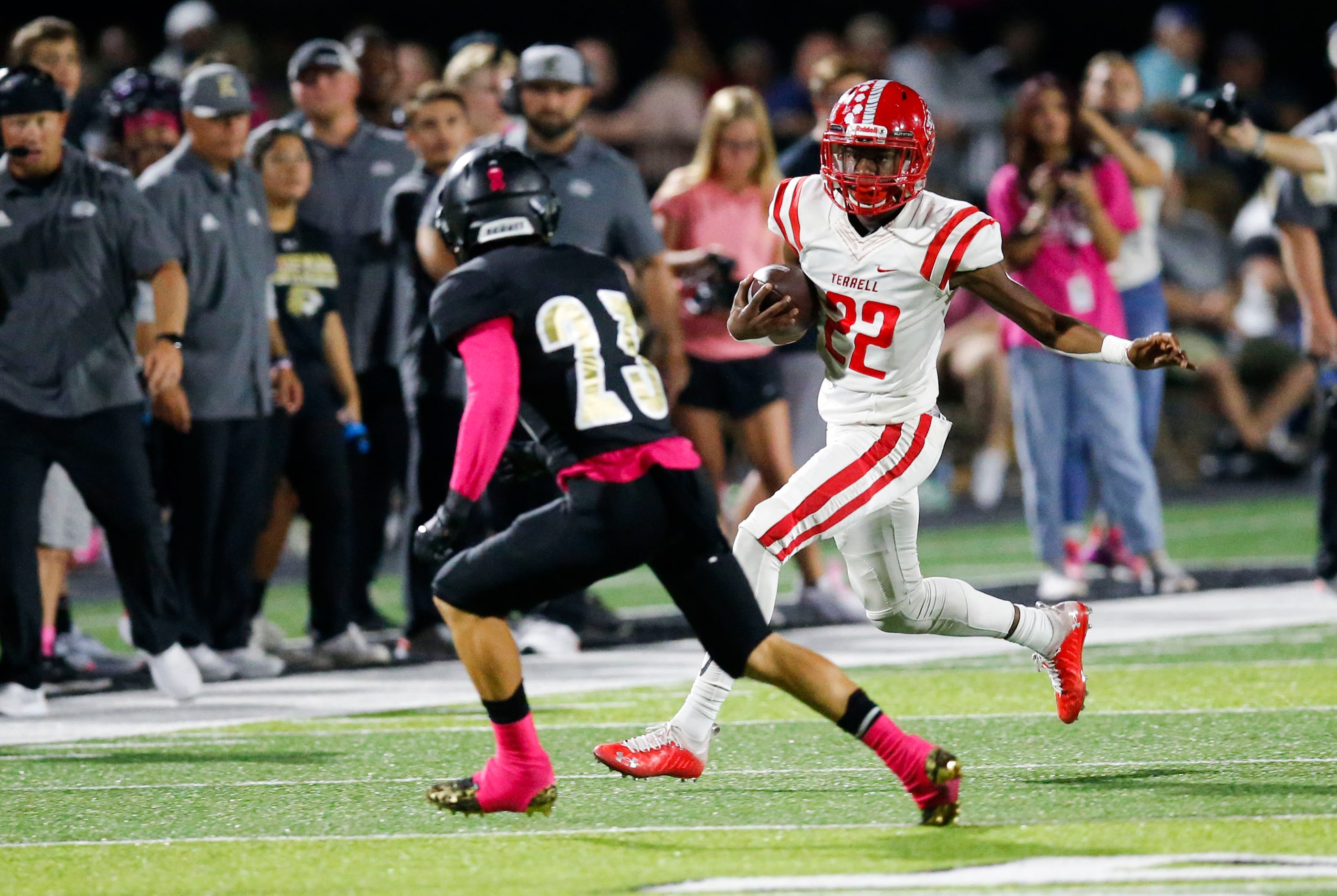 Terrell freshman Draden Fulbright (22) looks for room against Kaufman senior defensive back...