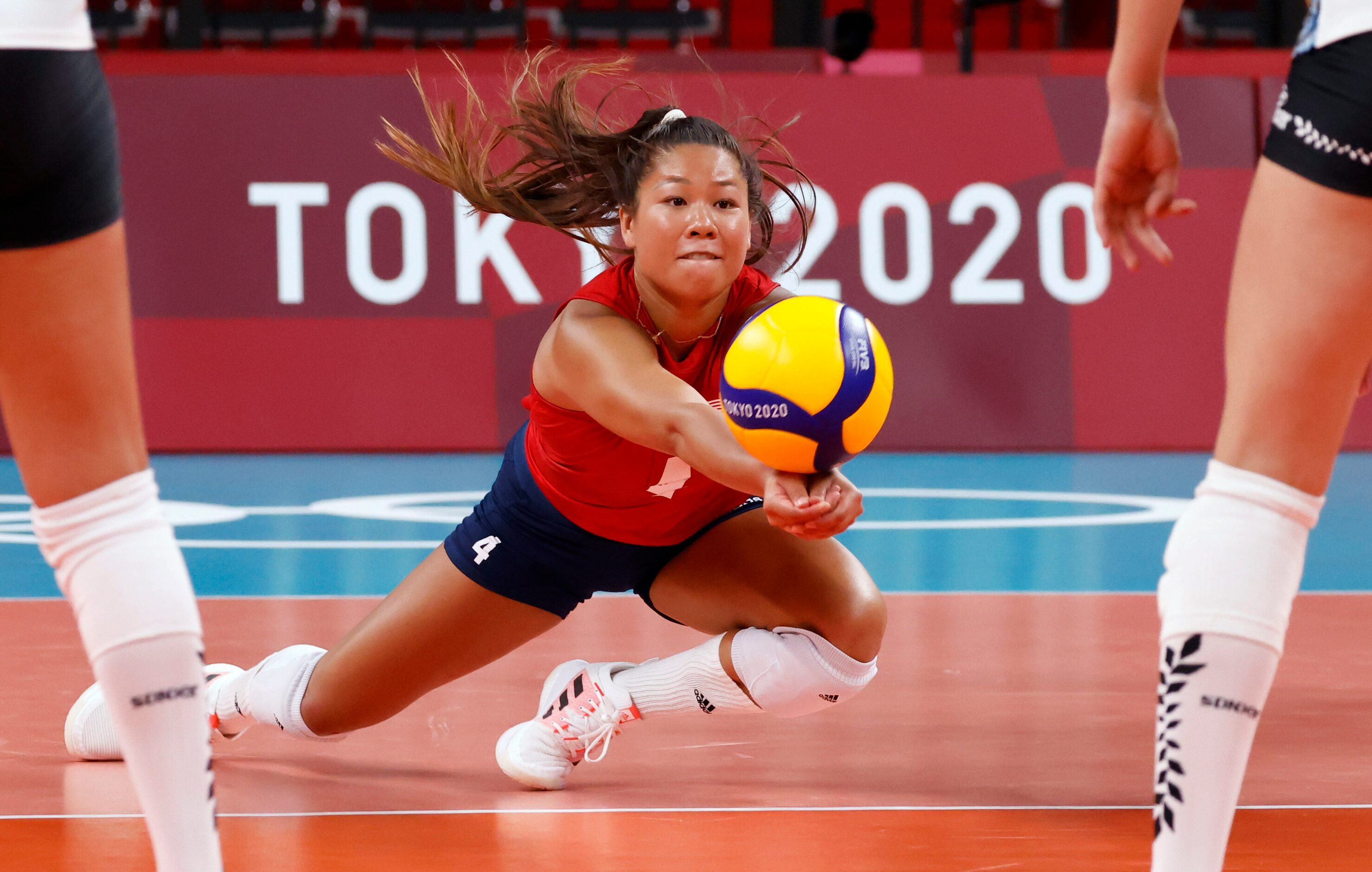 USA’s Justine Wong-Orantes (4) digs for the ball in a volleyball game against Argentina...