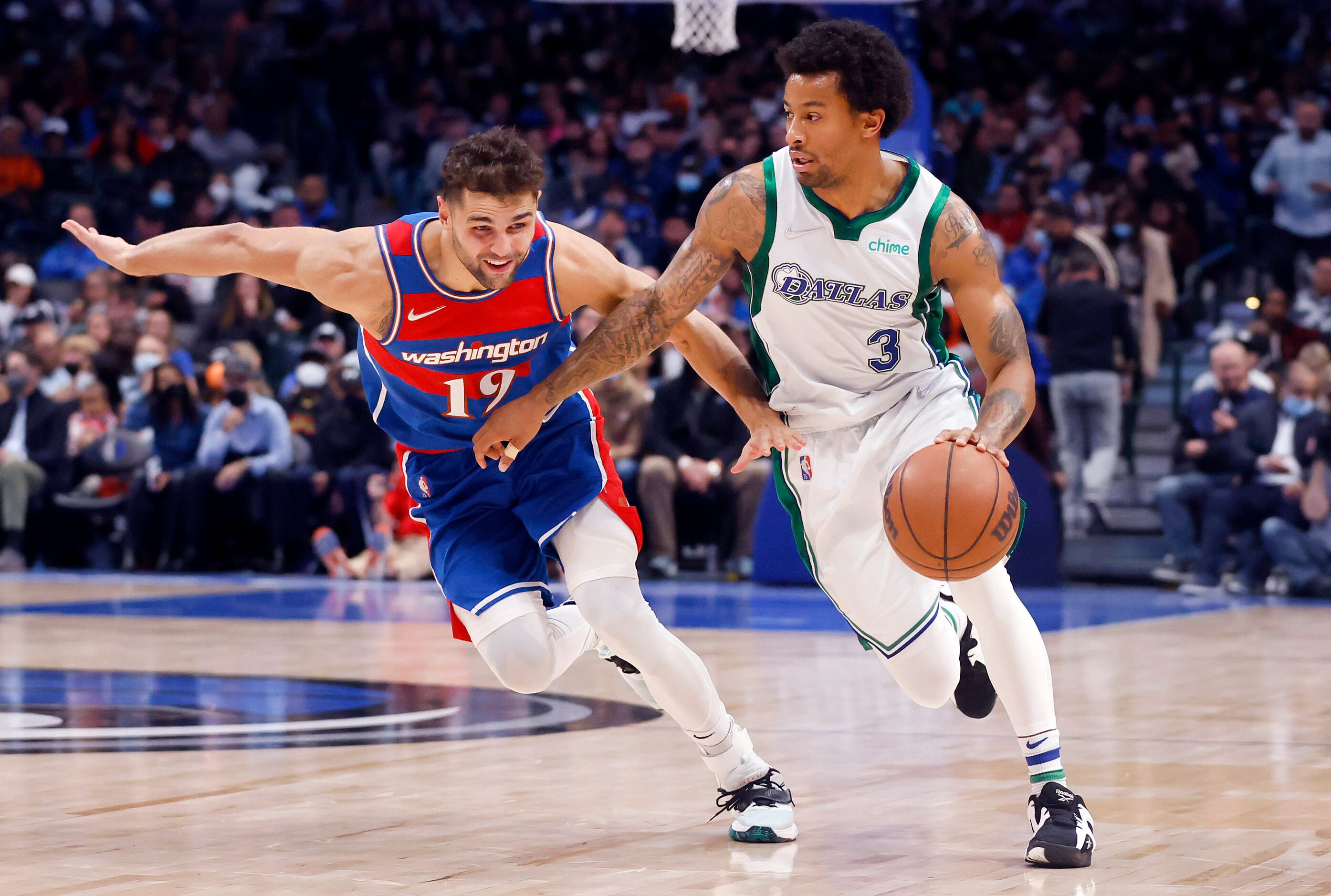 Dallas Mavericks guard Trey Burke (3) brings the ball up the court against Washington...