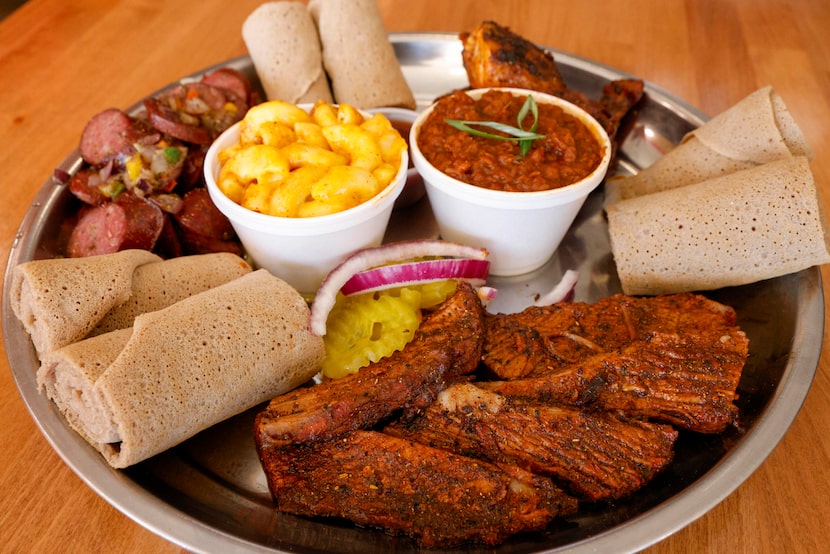 A barbecue plate of brisket, sausage and chicken seen at Smoke'N Ash BBQ, Wednesday, Nov....