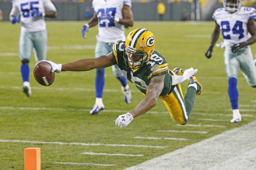 Green Bay Packers wide receiver Randall Cobb (18) dives for the end zone but was ruled out...