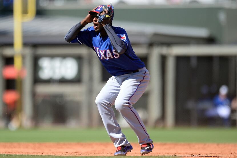 Mar 22, 2014; Surprise, AZ, USA; Texas Rangers second baseman Jurickson Profar (13) reacts...