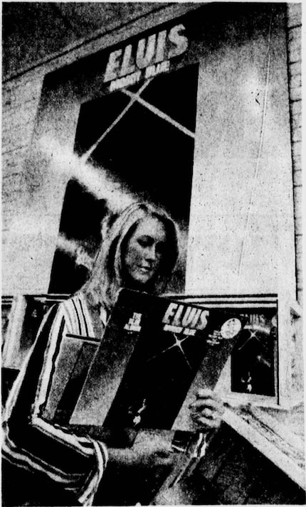 Aug. 18, 1977: A shopper hangs on to an Elvis album at The Melody Shop after The King's death.