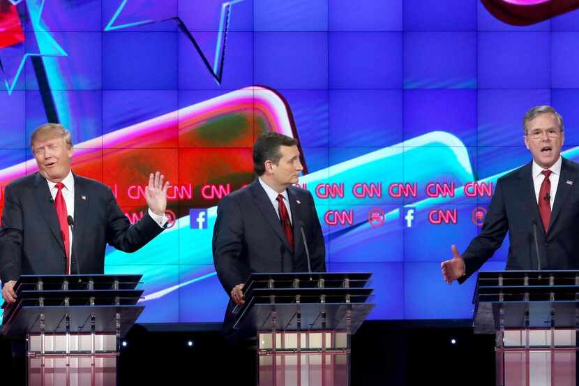 
With Ted Cruz positioned between them, Donald Trump and Jeb Bush sparred frequently in...