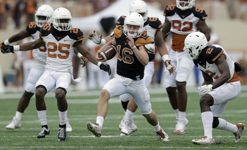Texas quarterback Shane Buechele (16) scrambles for yards during a spring NCAA college...