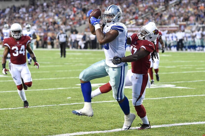 Dallas Cowboys tight end Rico Gathers (80) catches a 26-yard touchdown pass while defended...