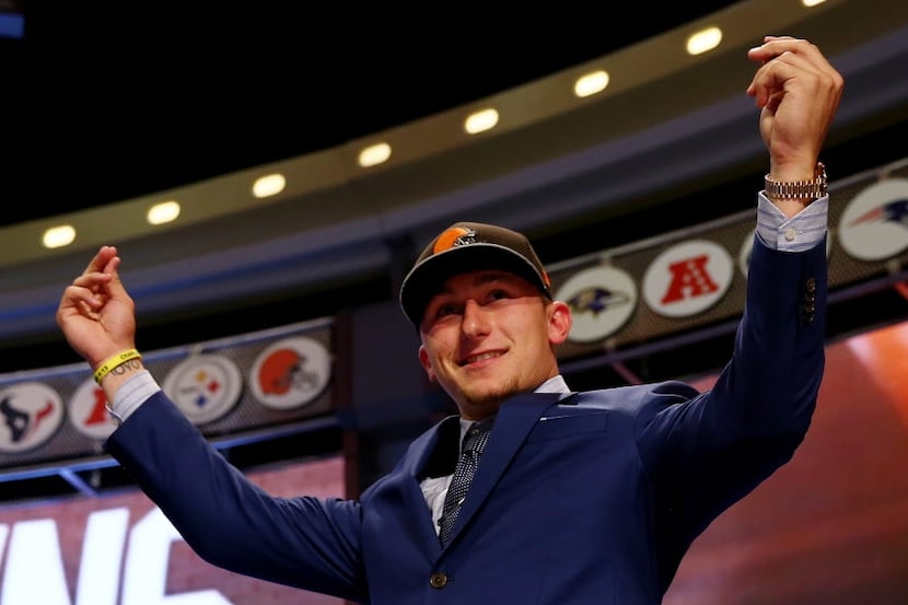 Johnny Manziel after he was picked #22 overall by the Cleveland Browns during the first...