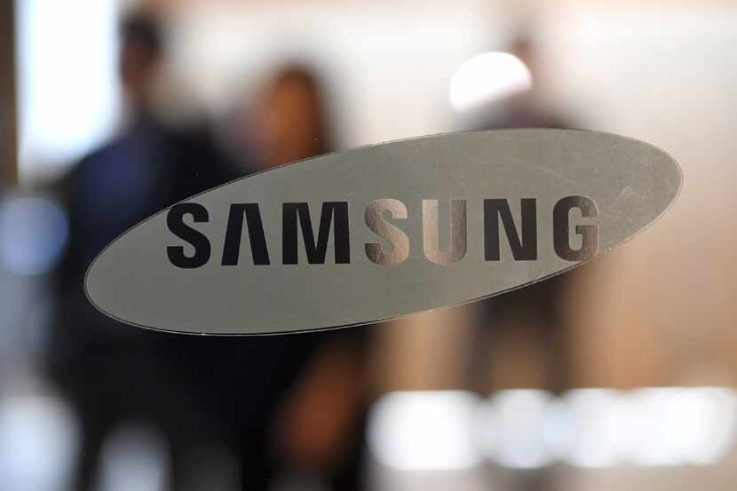 The logo of Samsung Electronics is seen on a glass door at the company's showroom in Seoul...