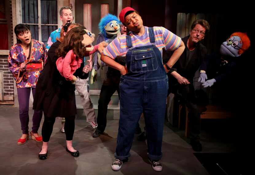 The cast of Avenue Q performs the opening number of Avenue Q on January 11, 2014 at Stage...