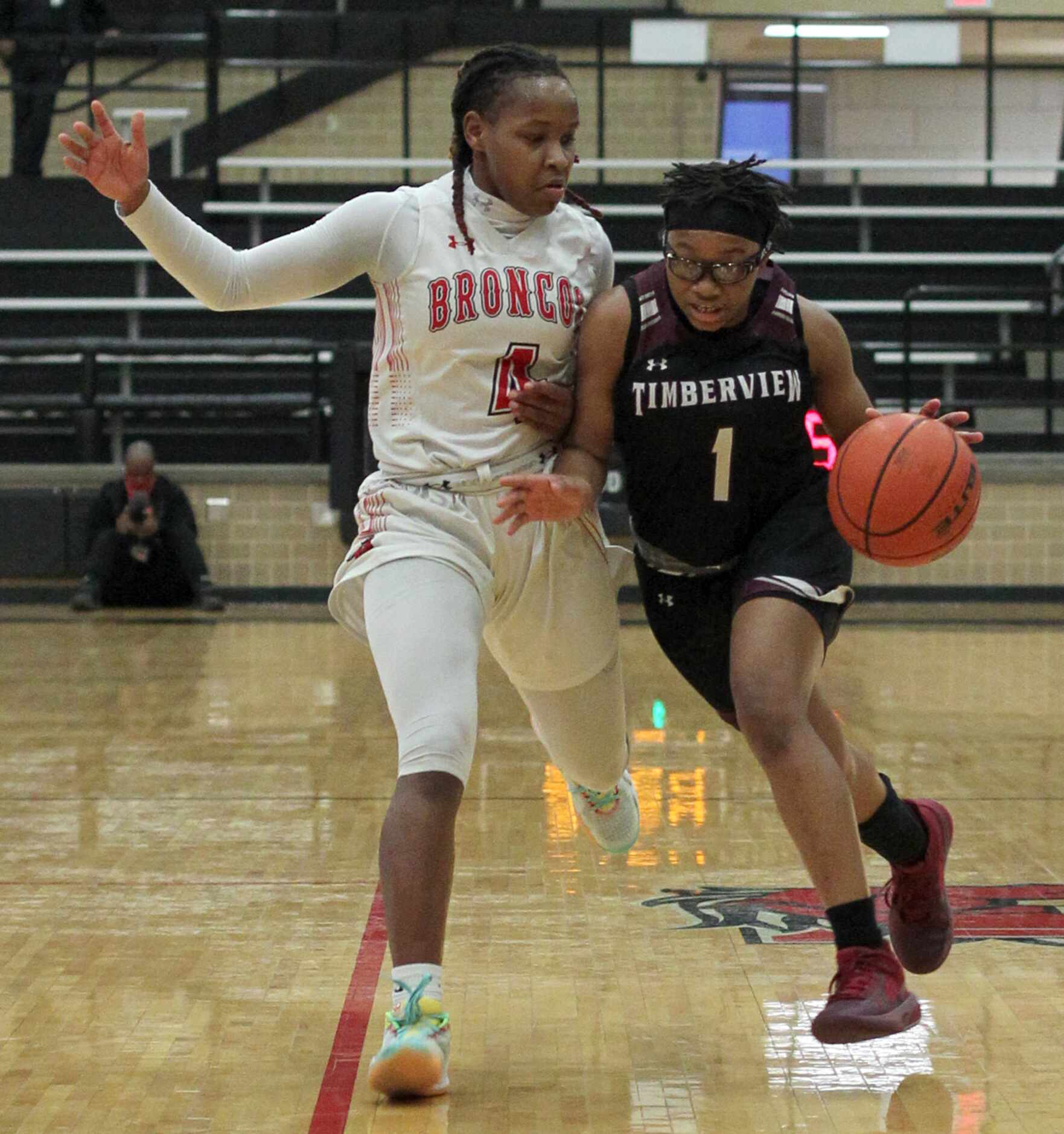 Mansfield Timberview guard Tamara Mims (1) drives against the defense of Mansfield Legacy...