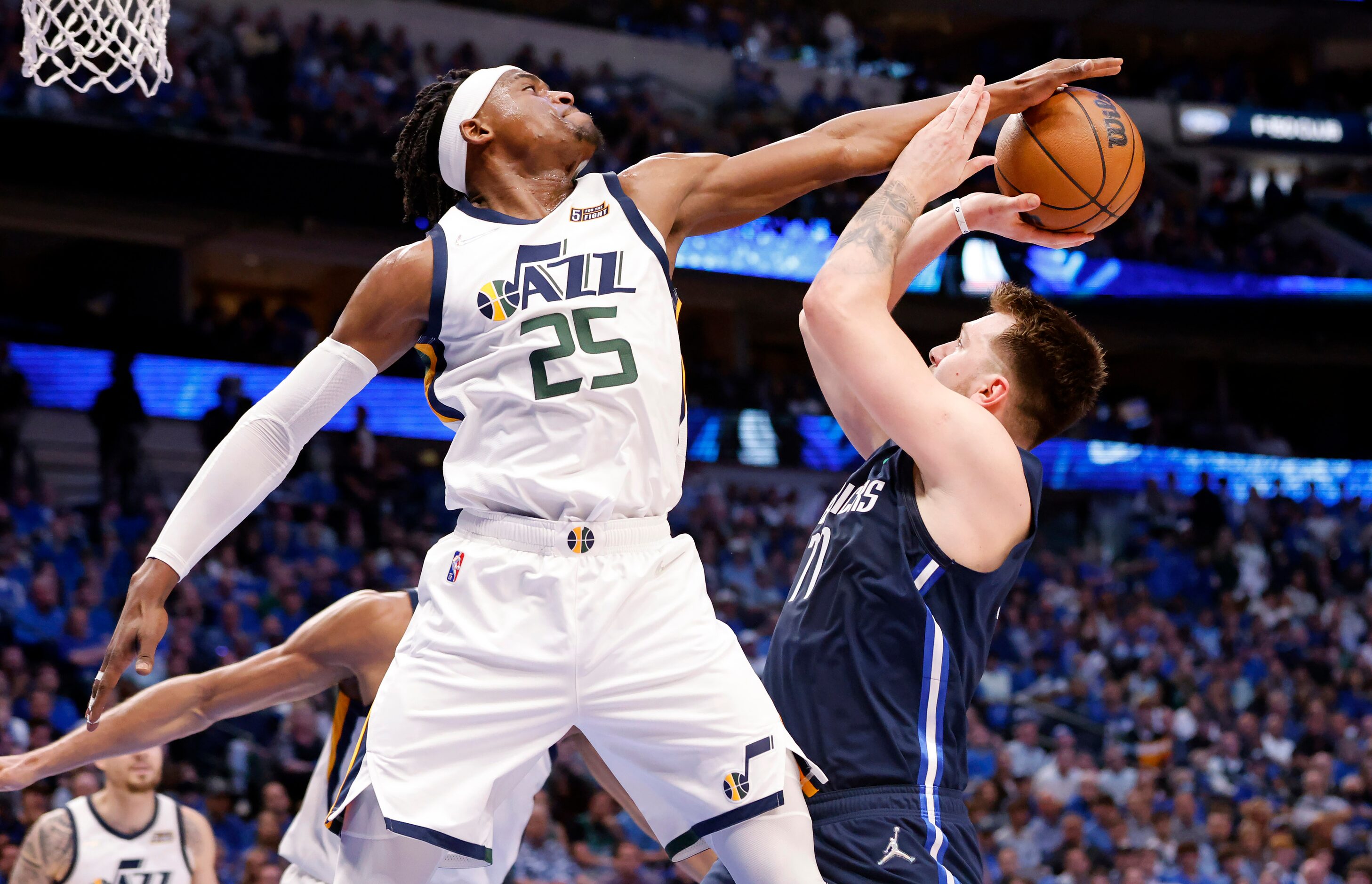 Dallas Mavericks guard Luka Doncic (77) has his shot blocked by Utah Jazz forward Danuel...