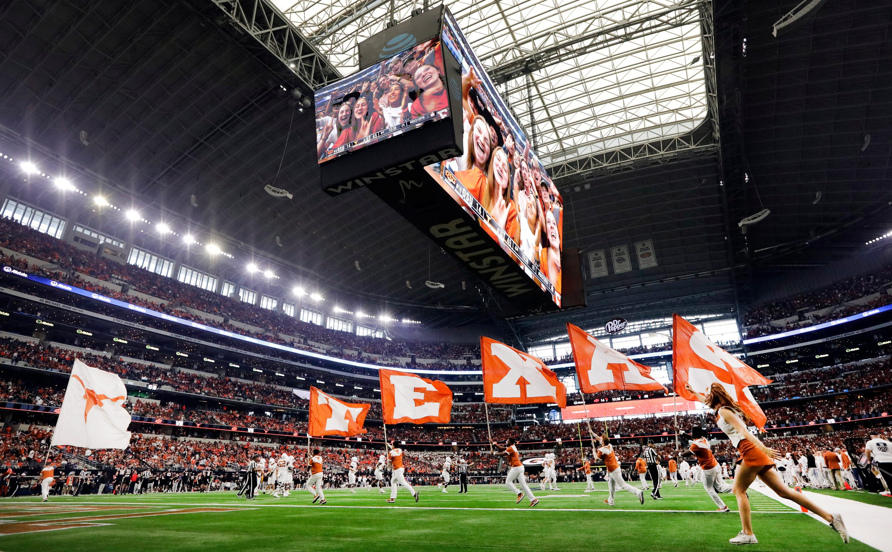 The Texas Longhorns spirit squad carries the school colors following a first half touchdown...