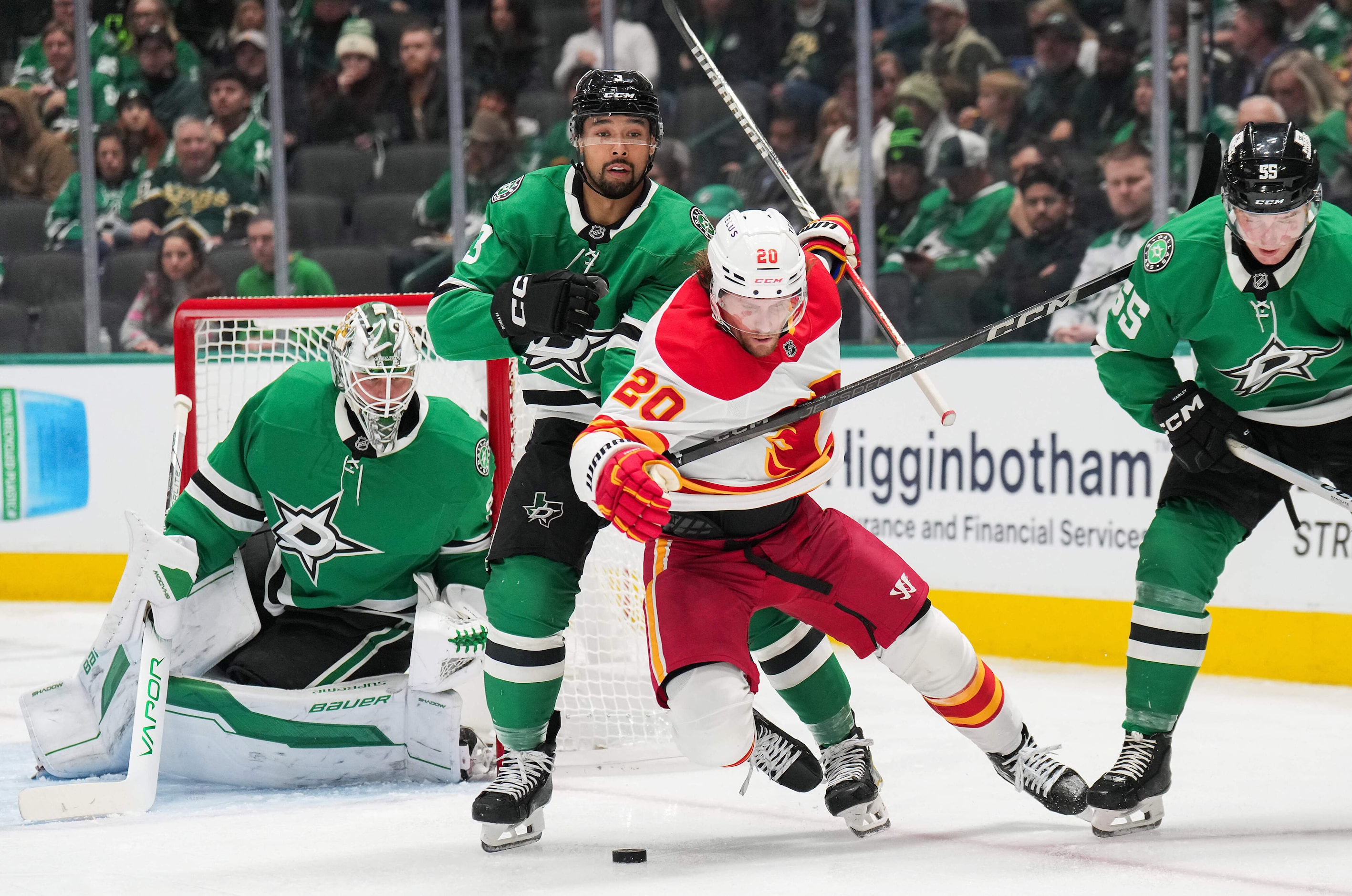 Calgary Flames center Blake Coleman (20) goes to the ice as Dallas Stars defenseman Mathew...