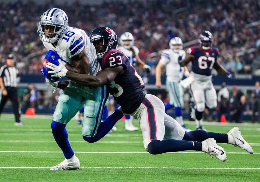 Dallas Cowboys wide receiver Ced Wilson (16) is tackled by Houston Texans defensive back...