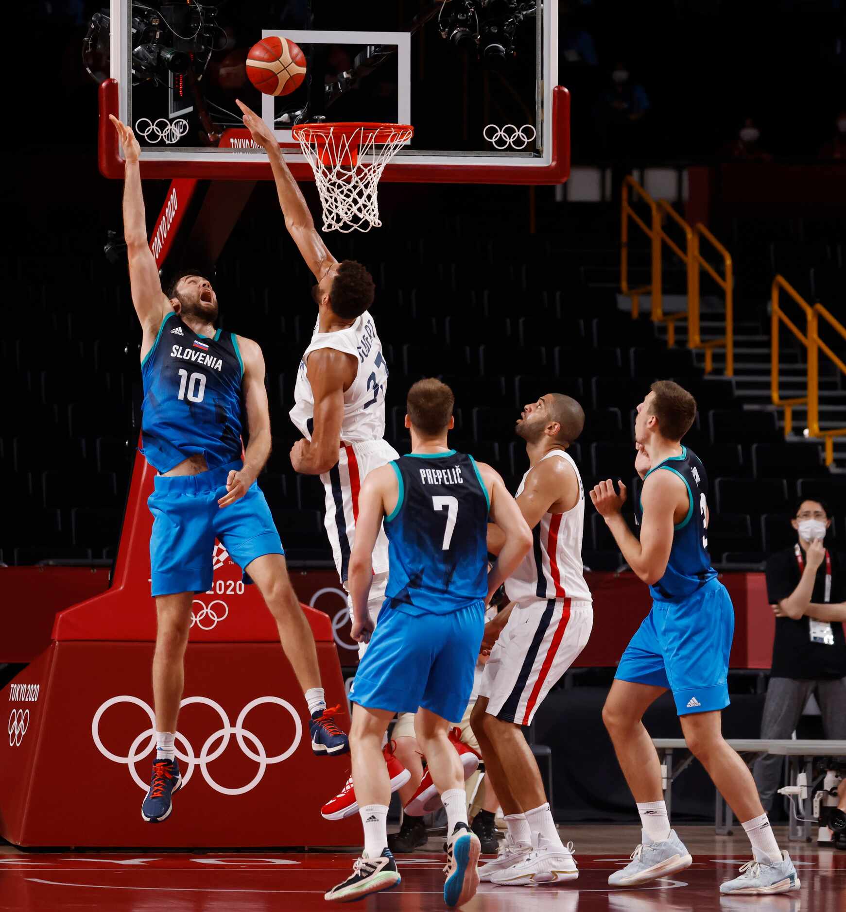 Slovenia’s Mike Tobey (10) makes a shot over the arms of France’s Rudy Gobert (27) during...