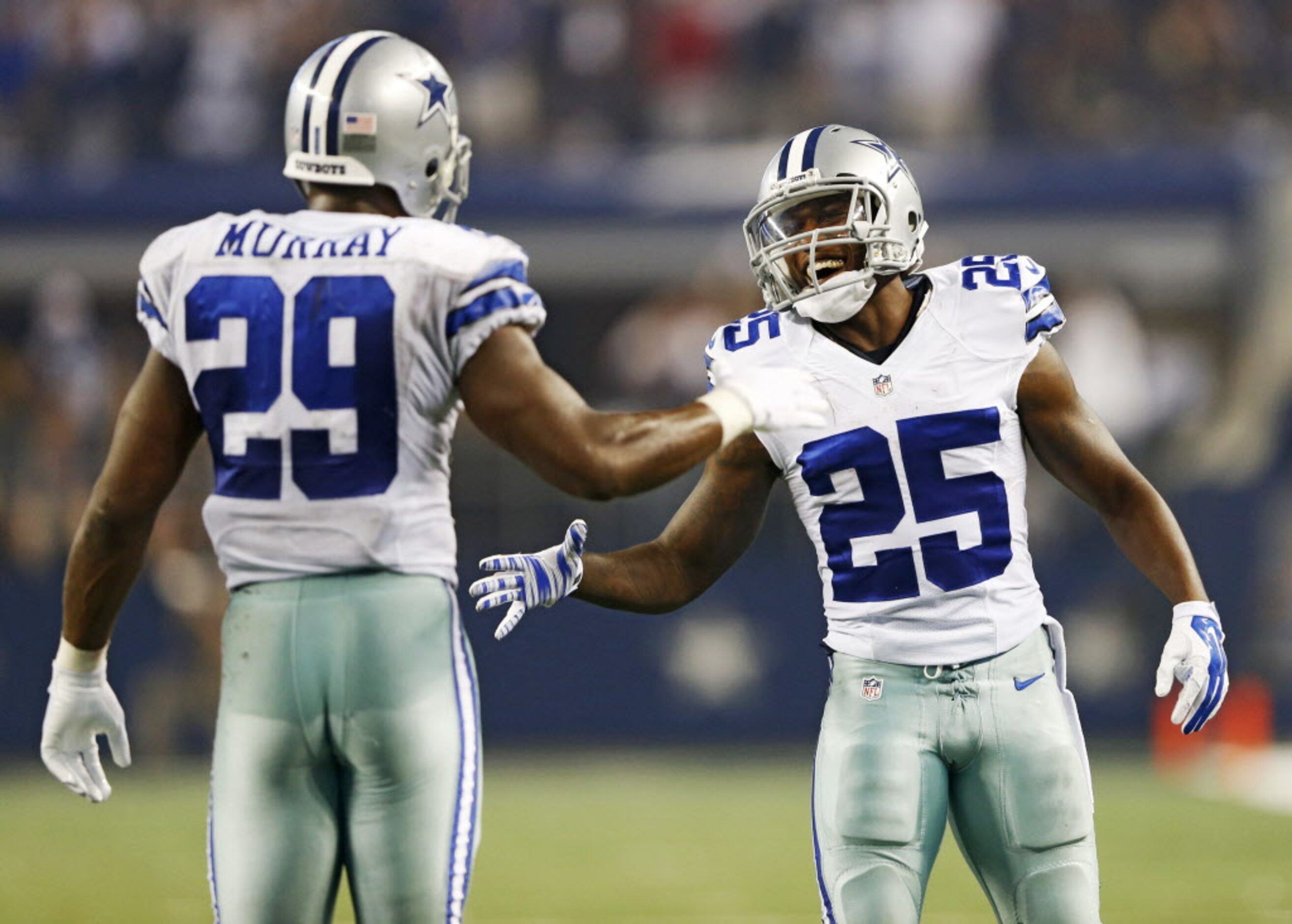 Dallas Cowboys running back Lance Dunbar (25) congratulates Dallas Cowboys running back...