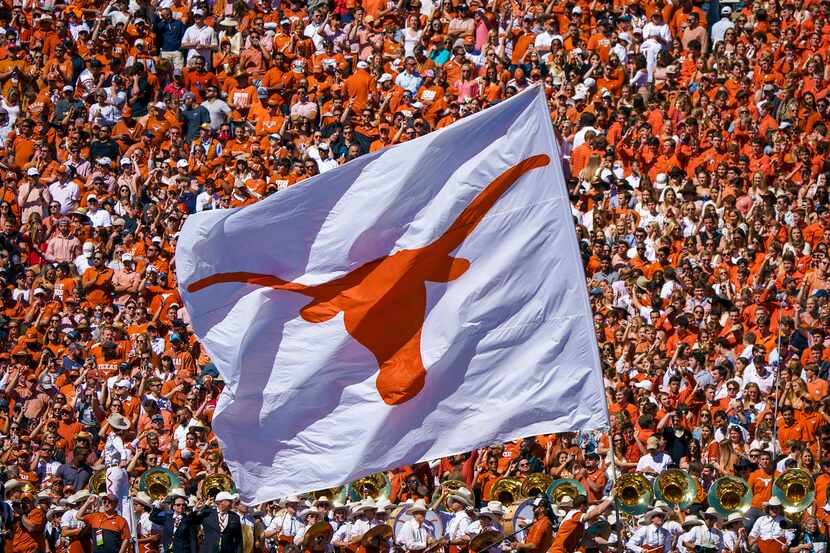 FILE - A Texas Longhorns flag is run across the field after a score in the second half of a...