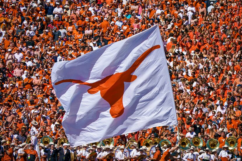 FILE - The Texas Longhorns flag is run across the field after a score during the second half...