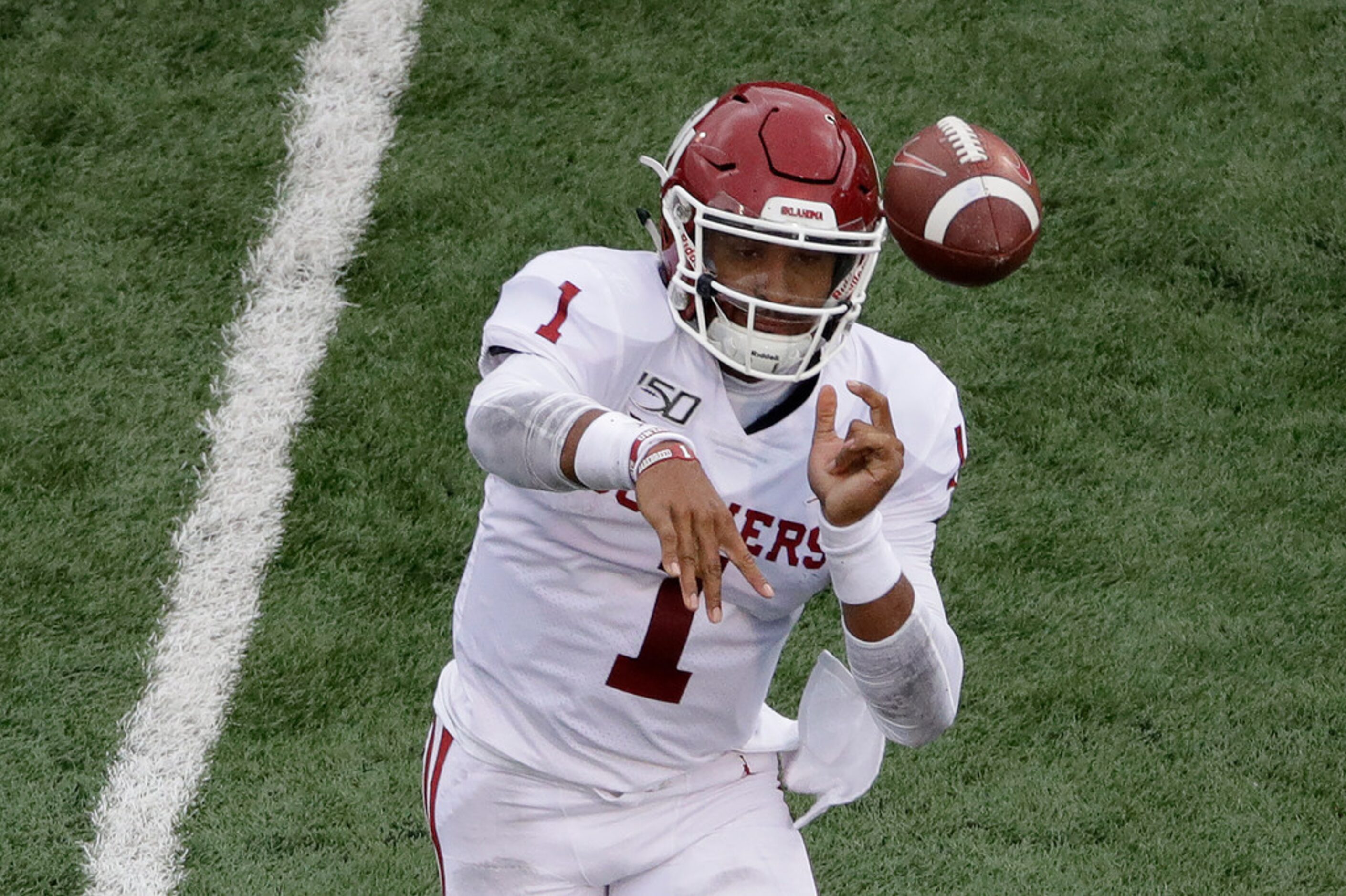 Oklahoma quarterback Jalen Hurts (1) throws a pass during the first half of an NCAA college...