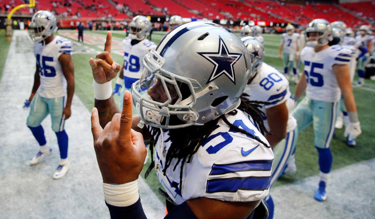 Dallas Cowboys middle linebacker Jaylon Smith (54) and his teammates get fired up before...