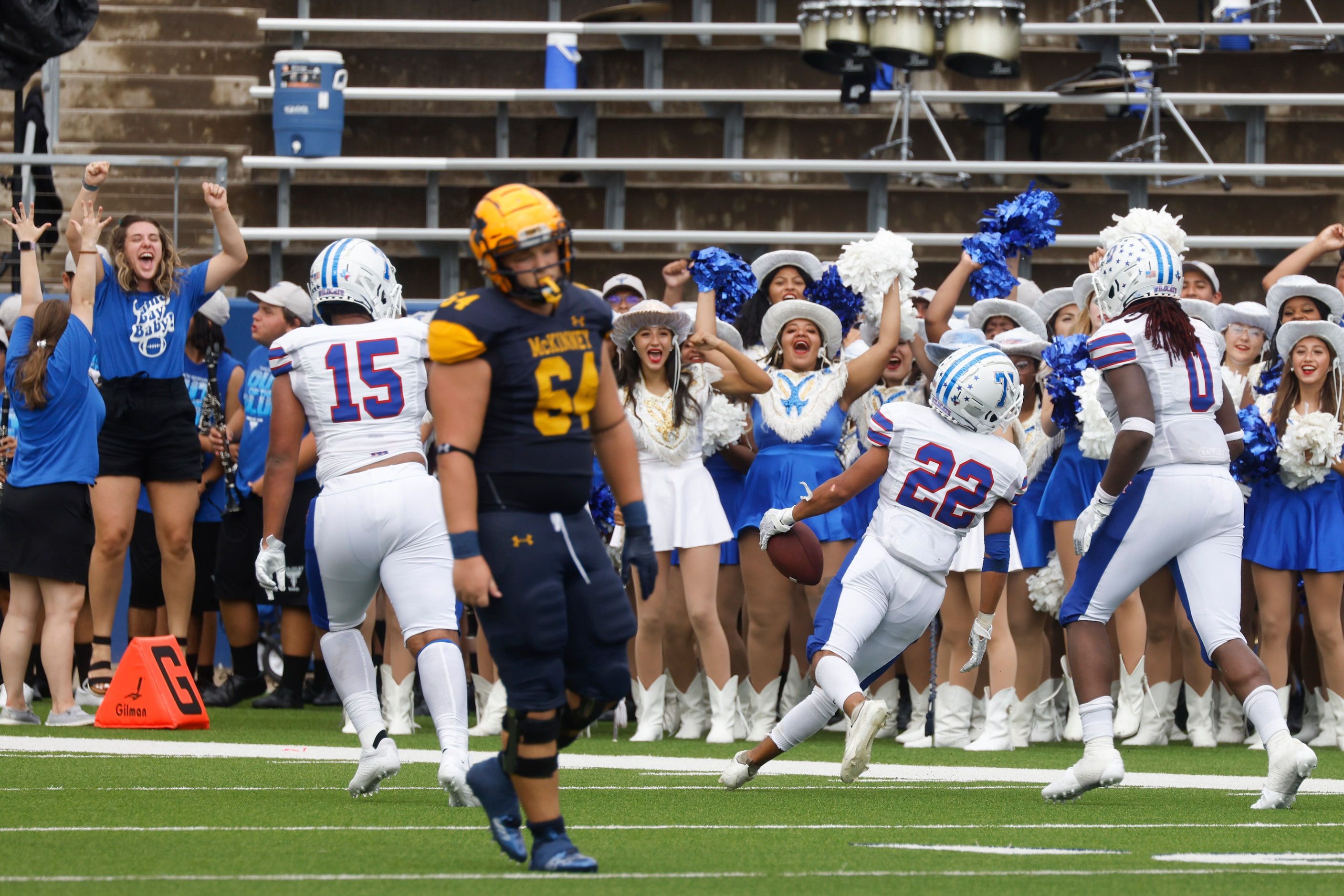 Crowd celebrates as Temple High’s Josh Donoso (22) intercepts a pass intended for McKinney...