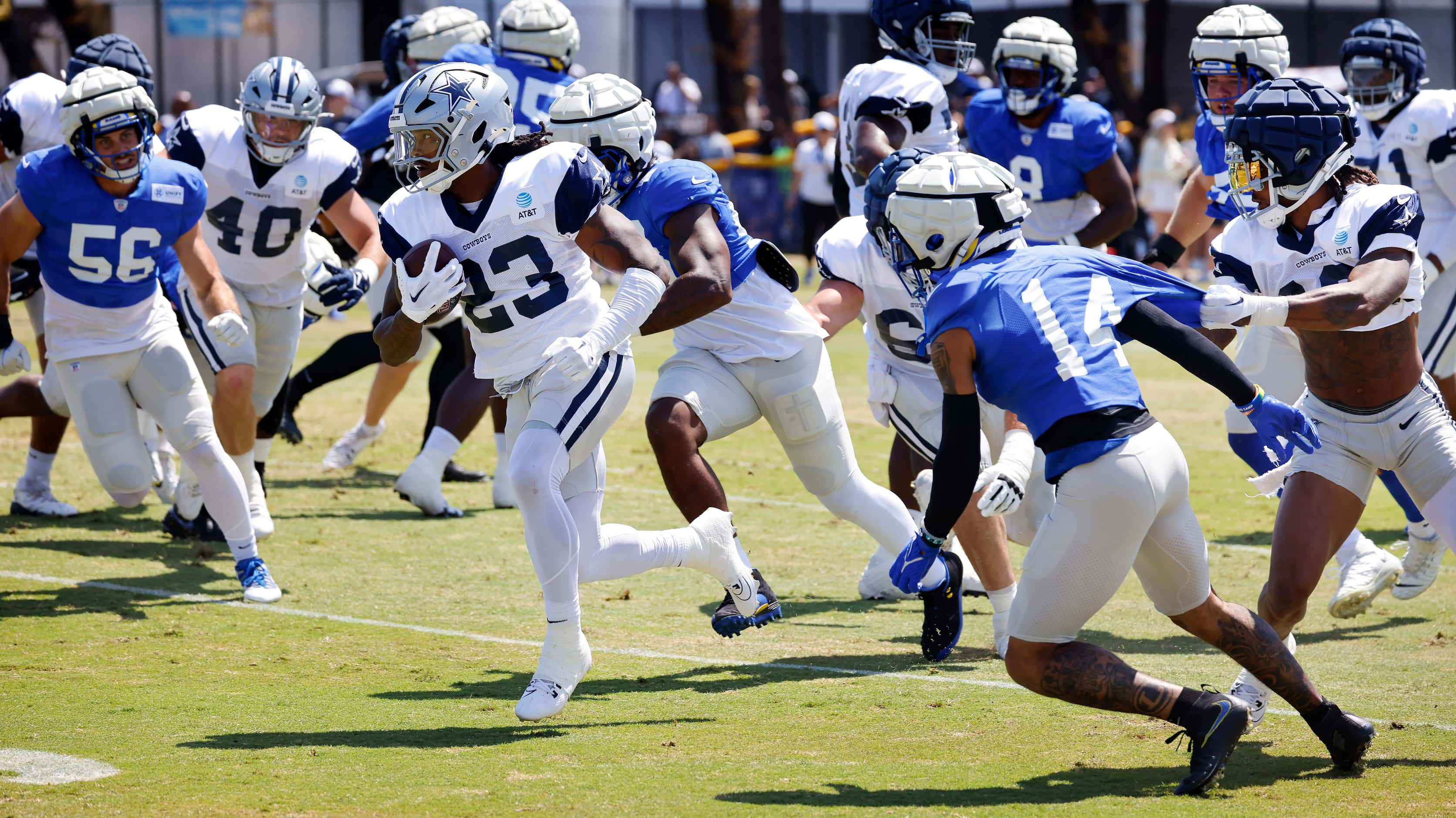 Dallas Cowboys running back Rico Dowdle (23) breaks away from the Los Angeles Rams defense...