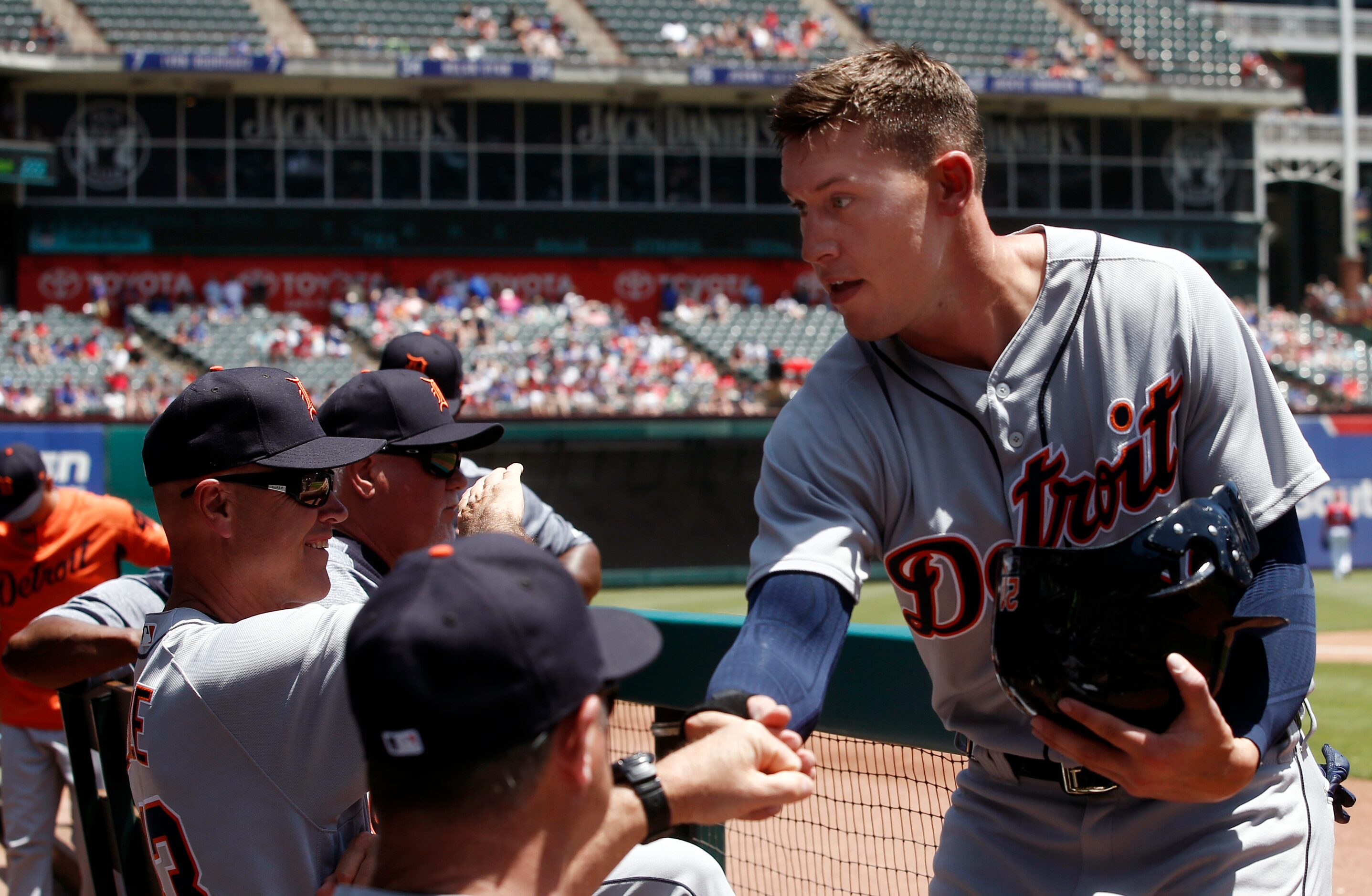 Detroit Tigersâ JaCoby Jones (21) is congratulated by teammates after scoring against the...